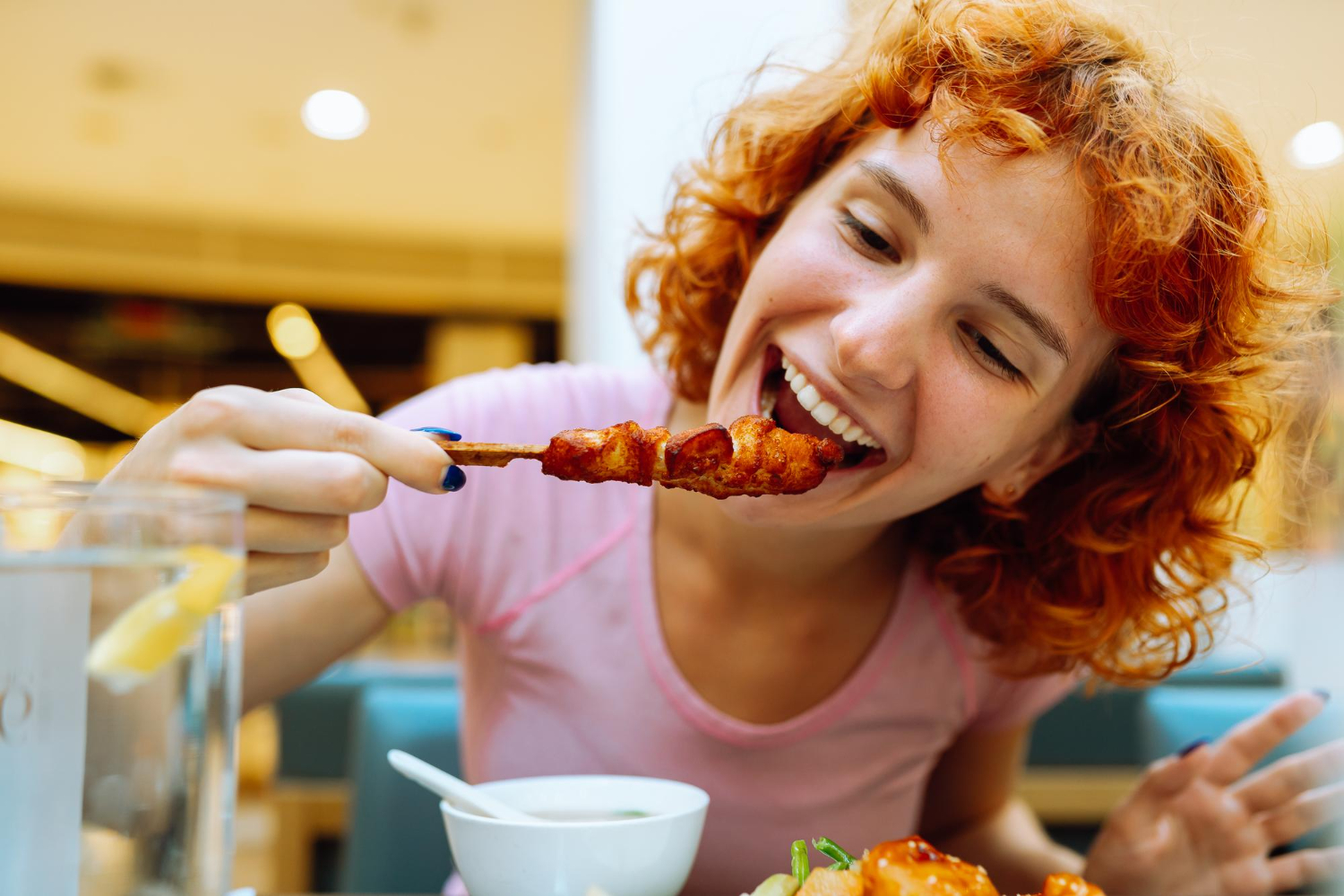 girl eating BBQ